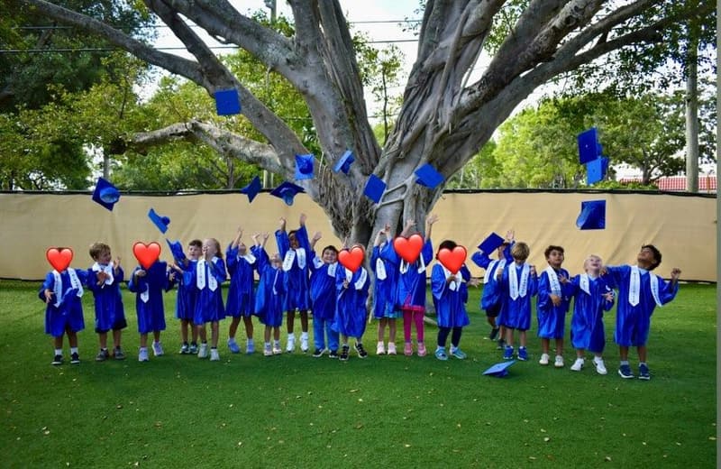 VPK graduates tossing their caps in the air