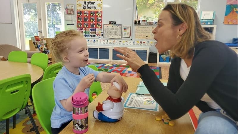 A teacher working one-on-one with a student