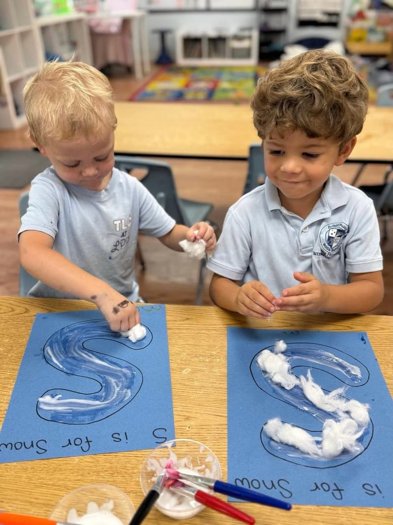 Students making cotton-ball art