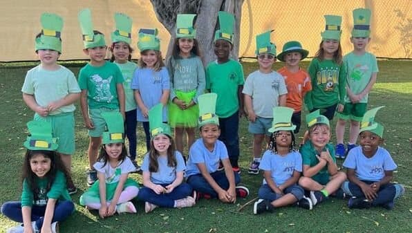 A class in green hats celebrating St. Patrick's Day